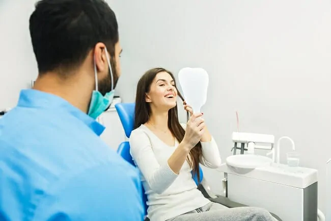 Dental Patient looking in mirror