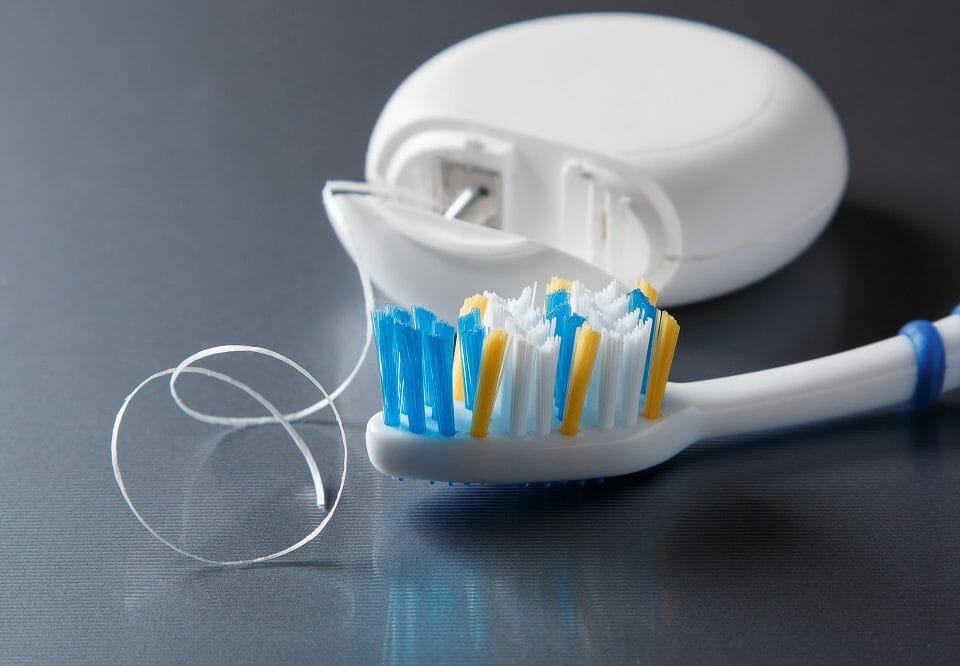 close up of toothbrush and floss