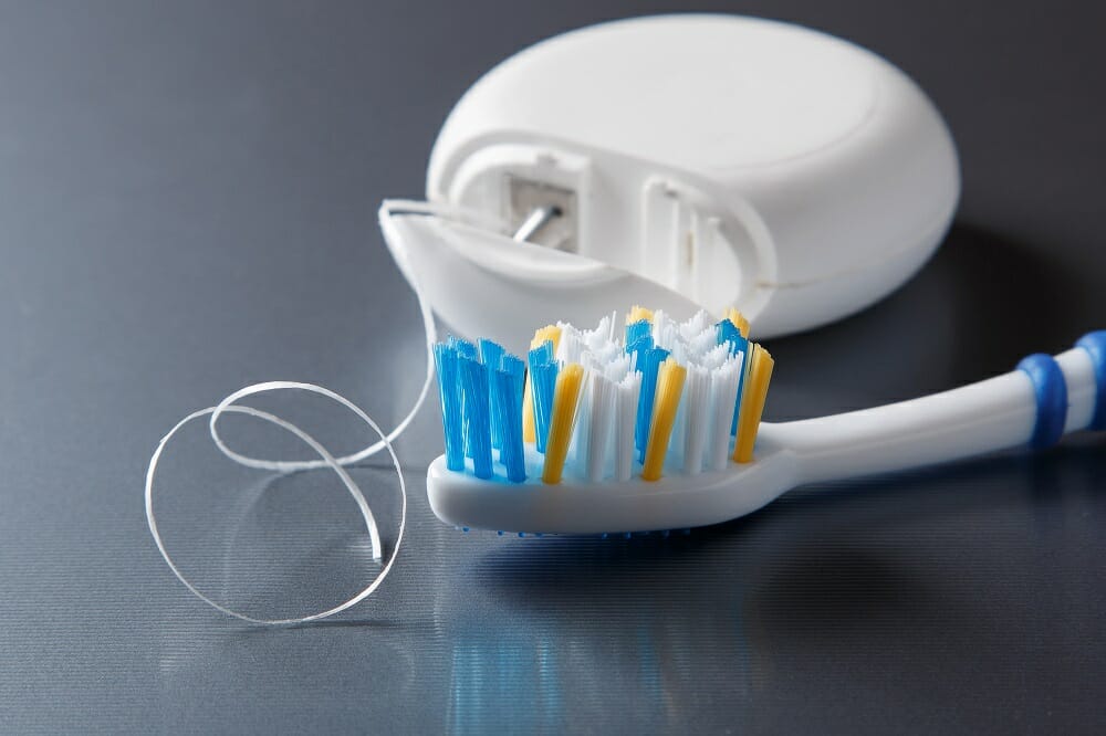 close up of toothbrush and floss