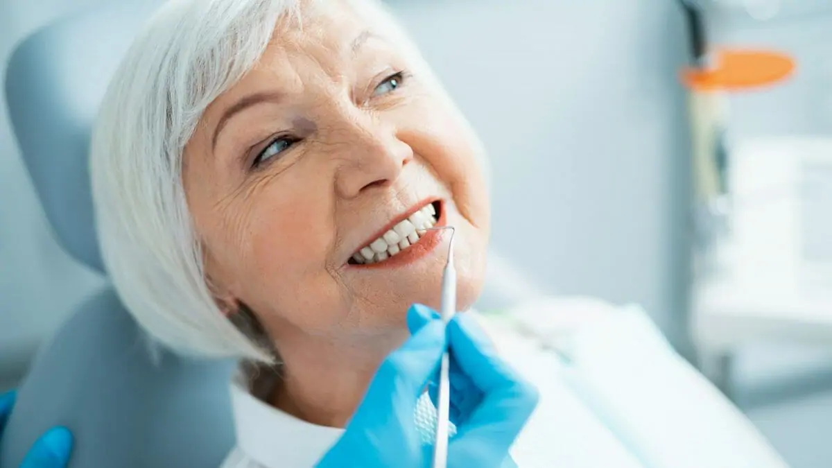 Woman getting teeth cleaned