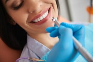 cleaning teeth for patient 