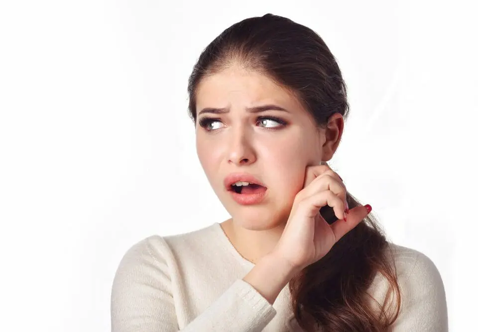 Woman in Pain Touching Jaw