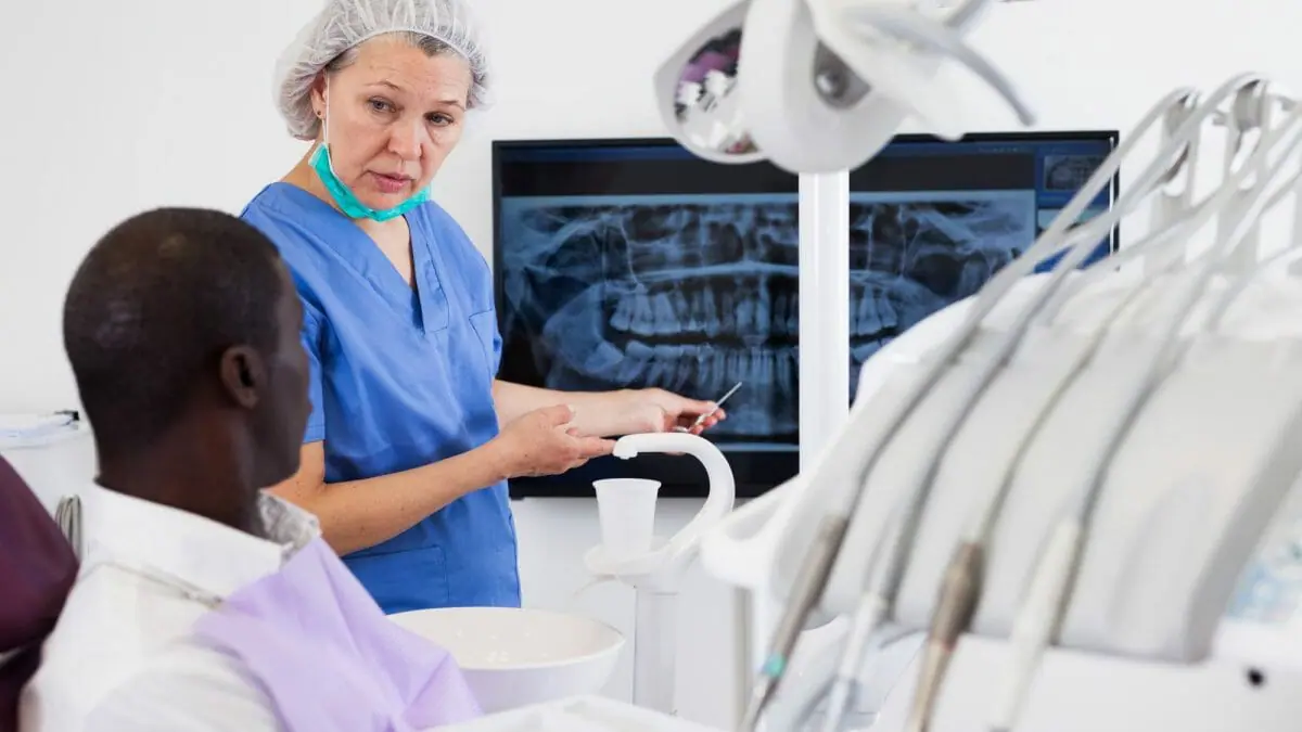 Dentist Showing Patient X-Ray