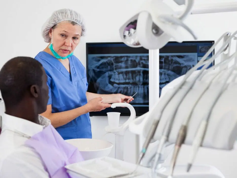 Dentist Showing Patient X-Ray